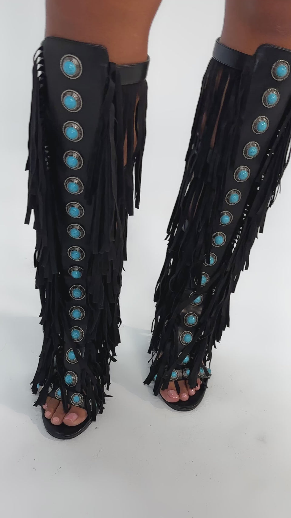 Video of woman modeling the AZALEA WANG AMADEO Black Fringe and Turquoise Gladiator Stiletto Sandal, featuring black fringe and turquoise accents