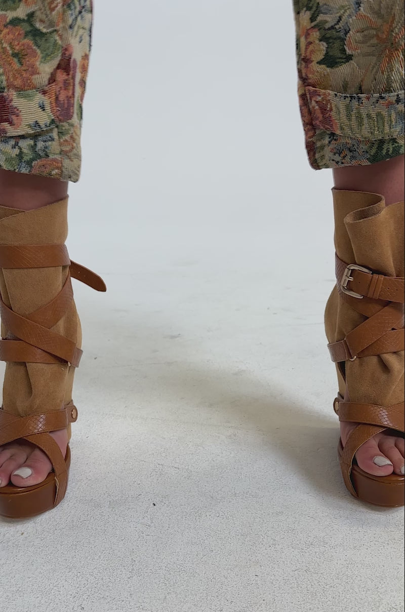 A video of a person wearing the AZALEA WANG ROTHKO WEDGE SANDAL IN CAMEL.