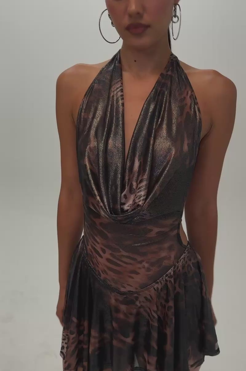 Video of a woman modeling the PARTY PEOPLE MINI DRESS IN CHEETAH—a metallic brown-and-black cheetah print mini dress with a cowl neckline and open back.