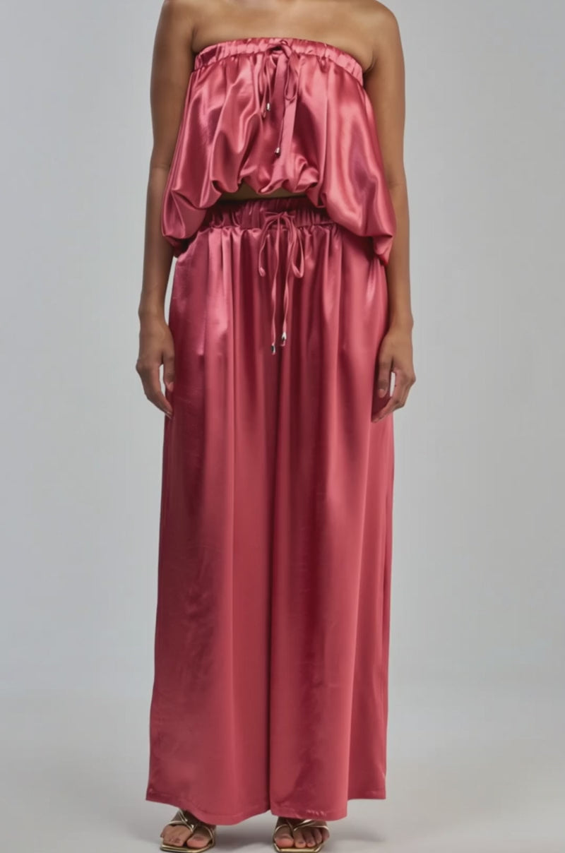 Video of a woman modeling the DREAM GIRL SATIN TOP in shiny pink satin.