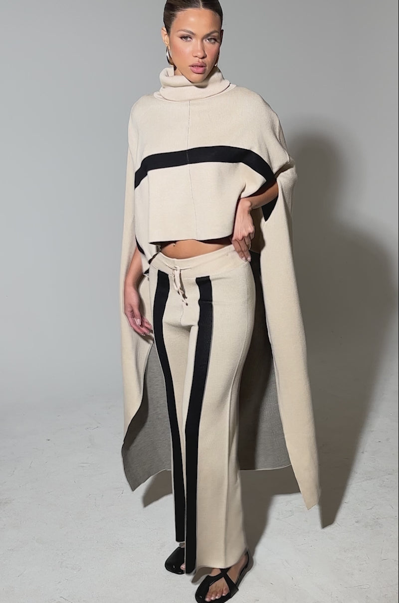 Video of woman modeling the CLAUDIA SWEATER WIDE LEG PANT featuring vertical black stripes