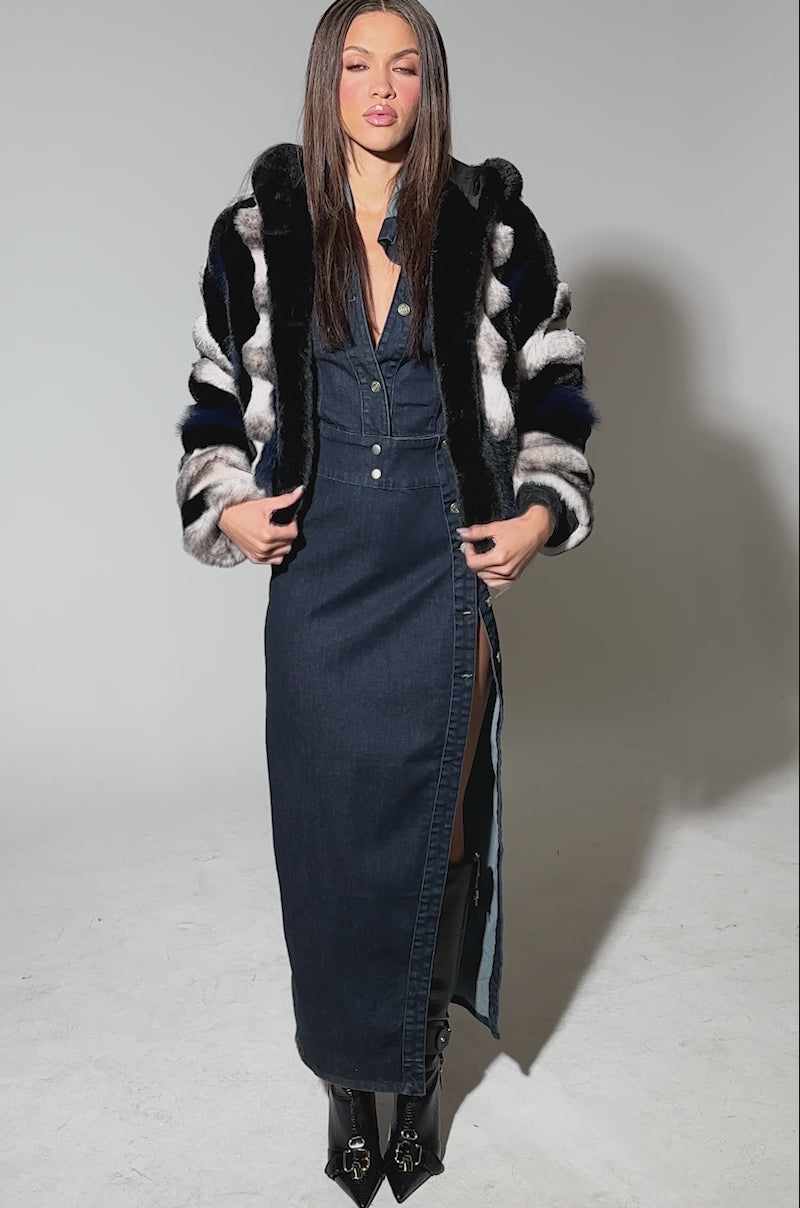 Video of a woman modeling the SUPERNOVA PANELED FAUX FUR IN BLUE MULTI jacket, featuring bold black, blue, and gray stripes