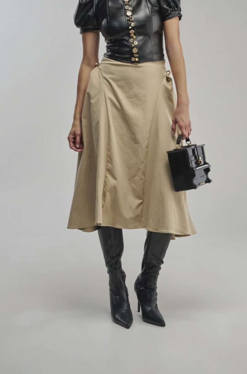 Video of a woman modeling the IT’S MY TIME MAXI SKIRT in beige.