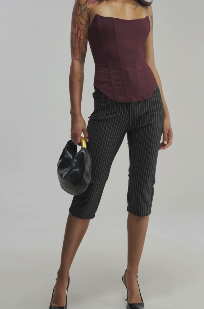 Video of a woman modeling the EVERYDAY LUXE CORSET IN BURGUNDY beneath a chic maroon blazer.