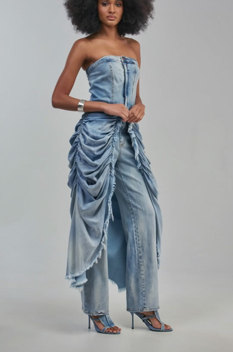Video of a woman modeling the REBEL HEART STRAPLESS DENIM JUMPSUIT—featuring high-waisted, ruched, and frayed pants with layered panels.