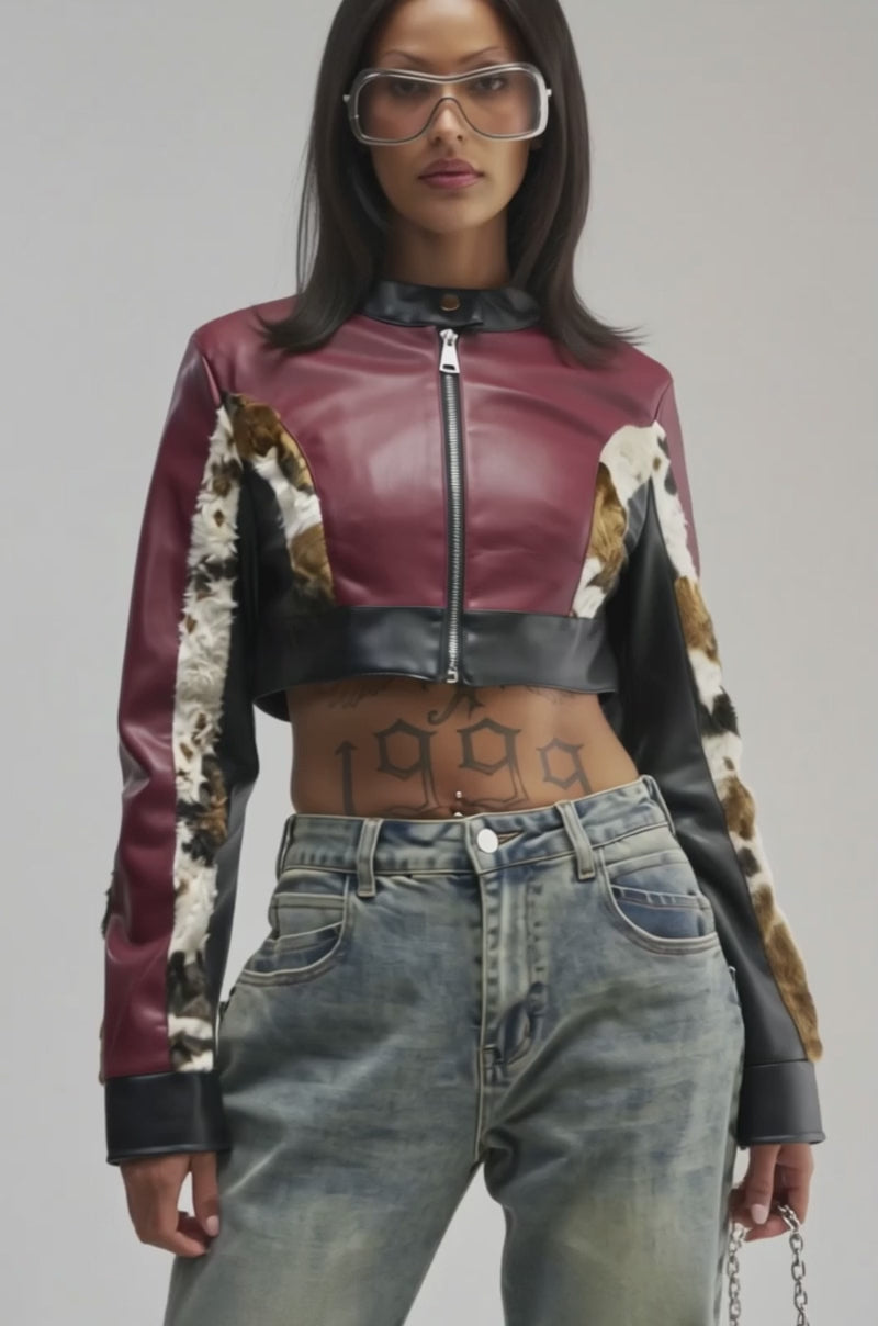 Video of a woman modeling the Wearing the WILD WEST RACER MOTO maroon faux leather cropped moto jacket with fur accents.