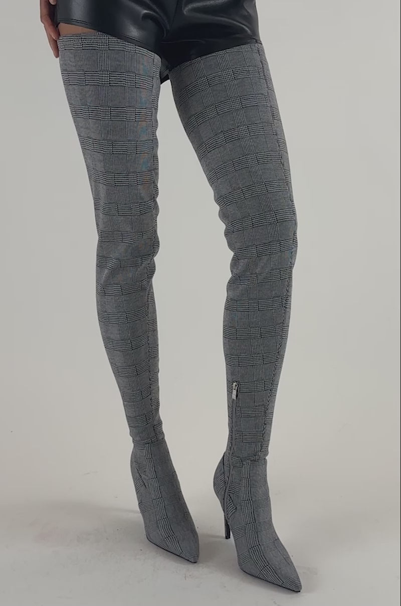 Video of a woman modeling the AZALEA WANG AVENOIR HOUNDSTOOTH OVER THE KNEE FOUR WAY STRETCH BOOT.
