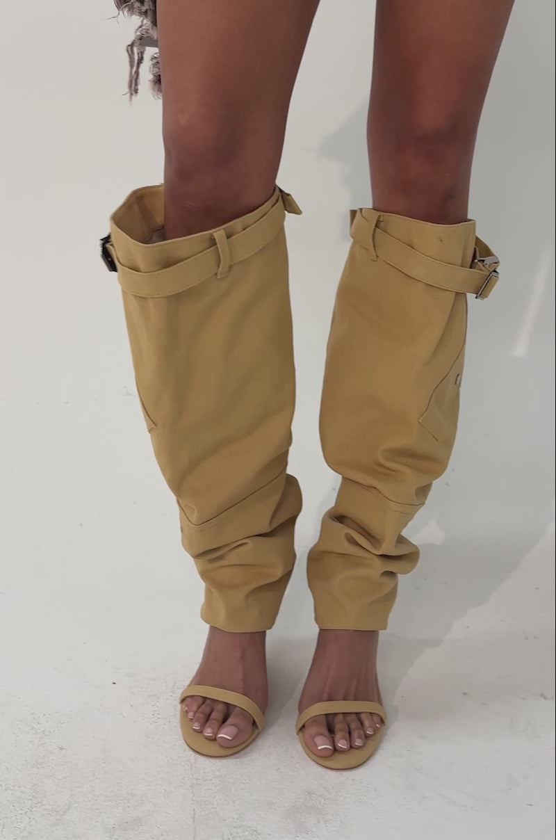 A video of a person wearing the AZALEA WANG ANOUK KHAKI SPORT WEDGE BOOT.