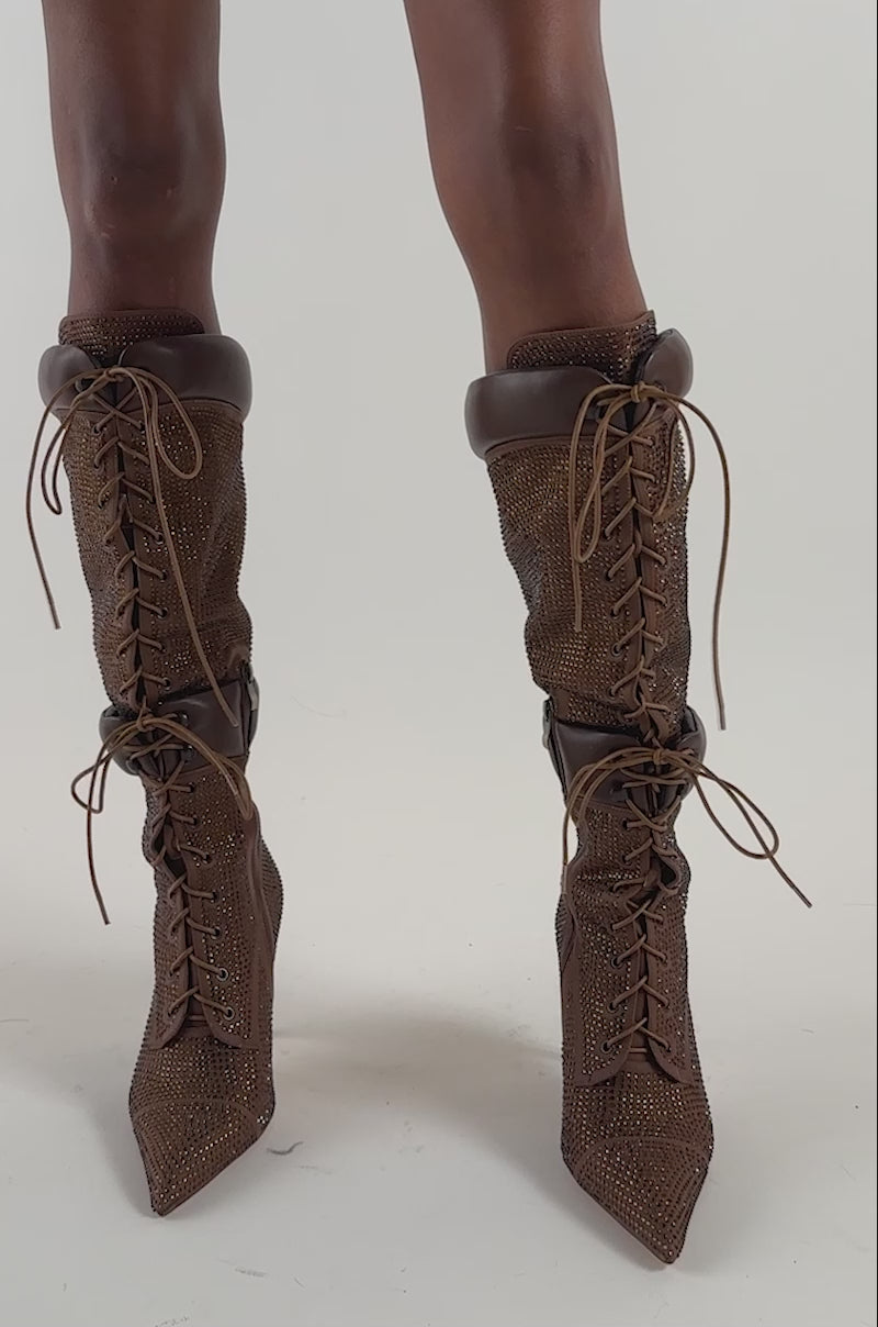 Video of a woman modeling the AKIRA Gold Calanthis Brown Rhinestone Stiletto Lace Up Boot.
