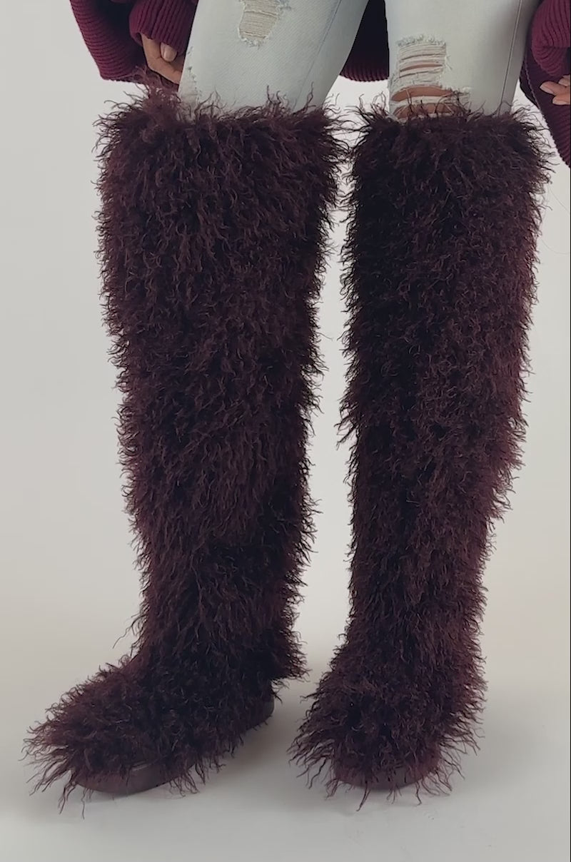 Video of a woman modeling the AZALEA WANG TEMPLETON BURGUNDY FAUX POODLE FUR OVER THE KNEE BOOT.