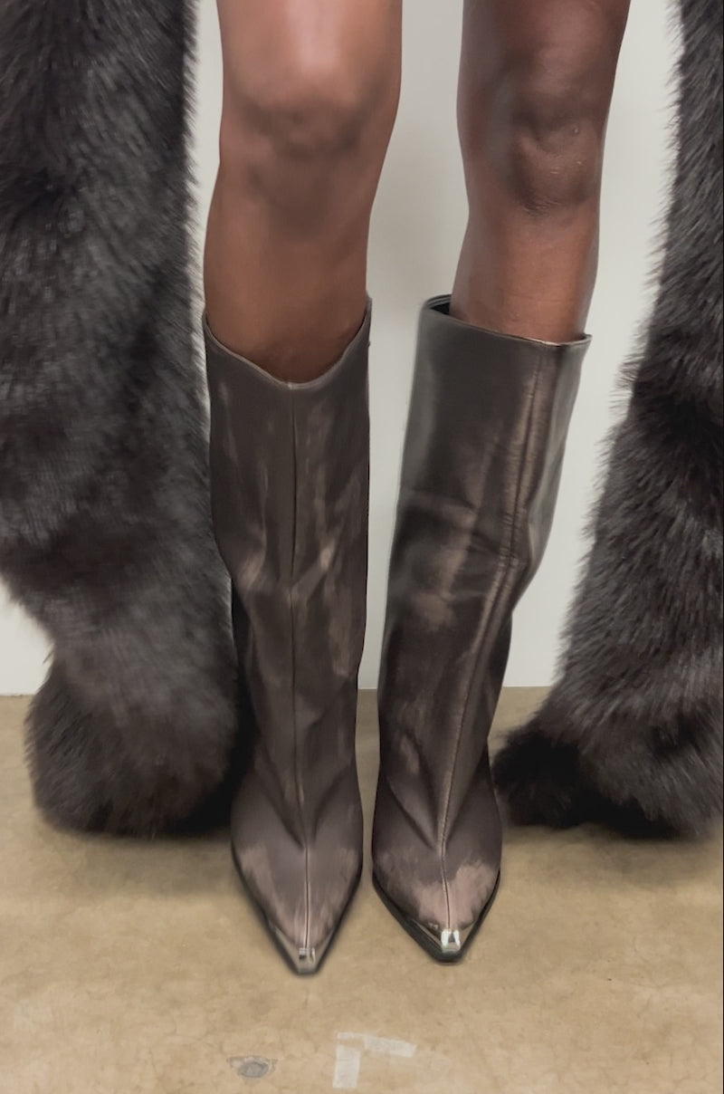 Video of woman modeling the AZALEA WANG DUSTY BROWN WEATHERED PU BOOTS, while a dark fur coat is draped behind her