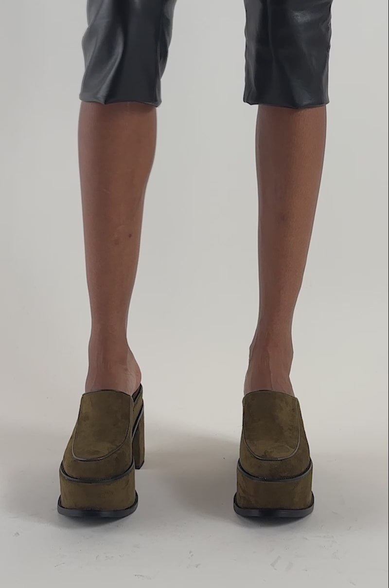 Video of a woman modeling the AZALEA WANG KATRIEL Olive Faux Suede Pumps, featuring a sturdy block heel.