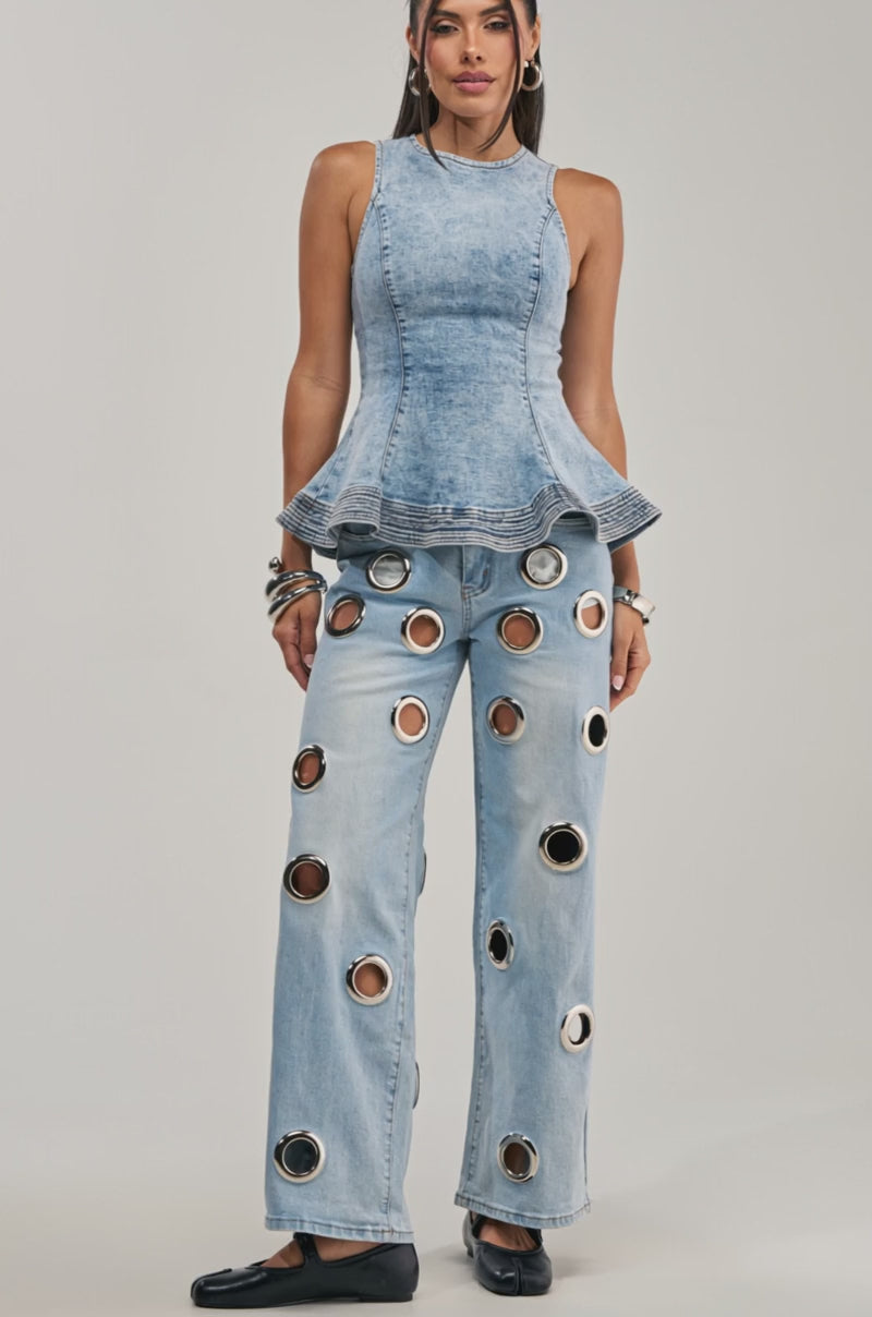 Video of a woman modeling the JESSI DENIM PEPLUM TOP.