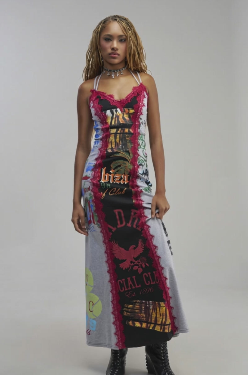 Video of a woman modeling the KISS AND TELL MAXI DRESS IN RED MULTI, featuring vibrant colorblocking and red lace trim.