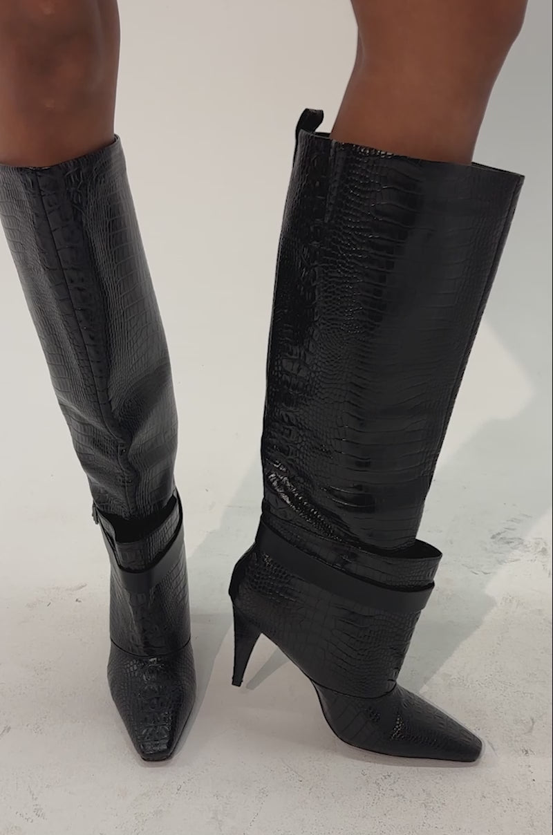 Video of a woman modeling the AZALEA WANG ARIELLE BLACK CROC BOOT, featuring a black croc-embossed texture.