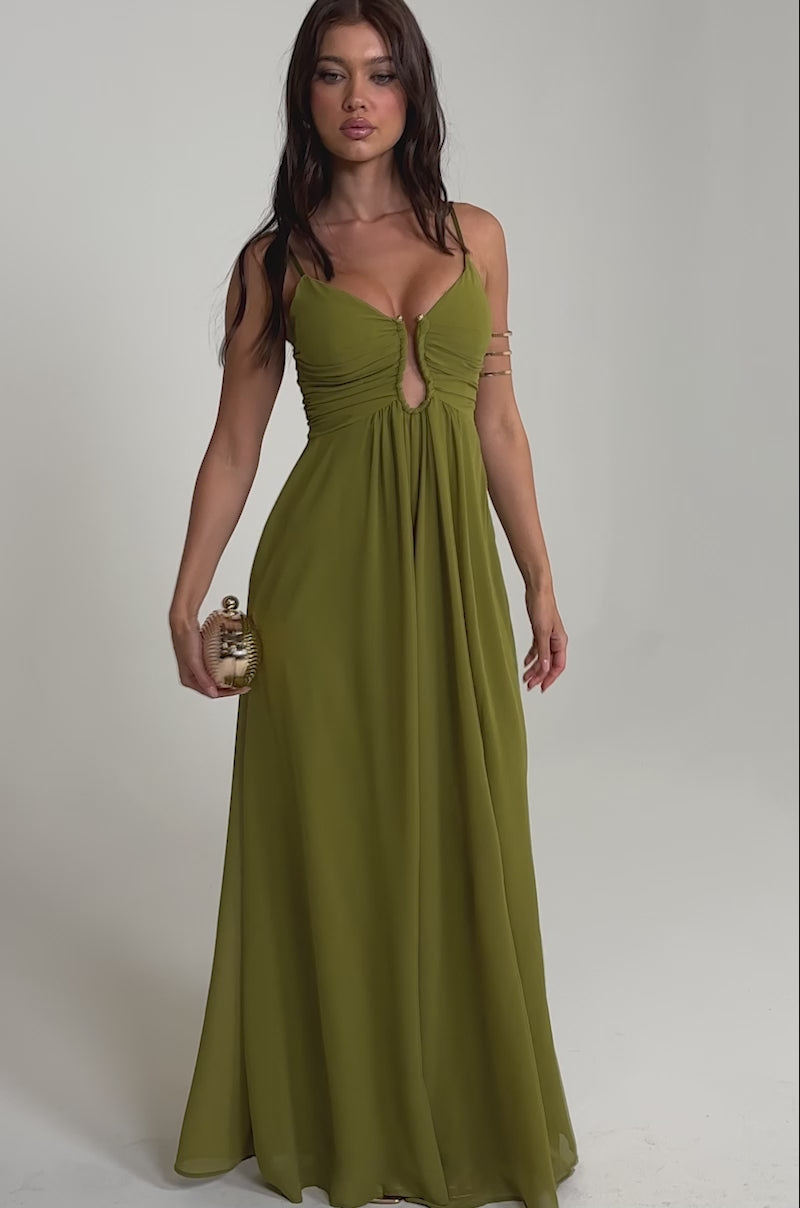 Video of woman modeling the LATE NIGHT IN KAUAI JUMPSUIT, an olive wide-leg style with a gathered bodice and keyhole cutout
