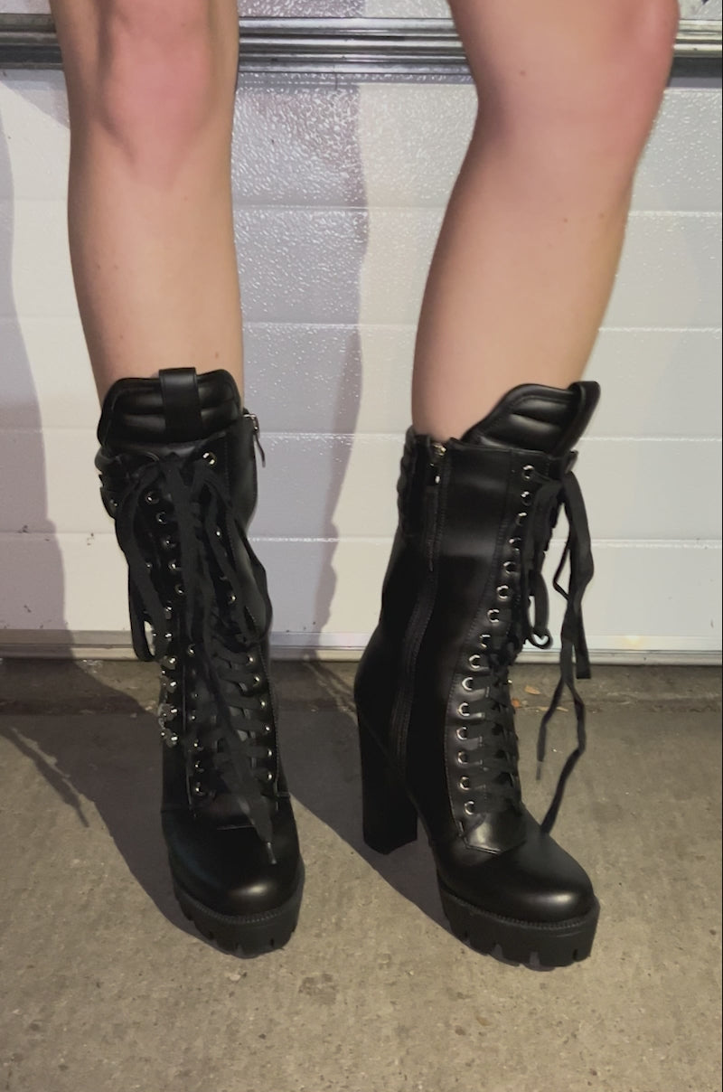 Video of person wearing and showing off all angles of the AZALEA WANG LUUK Black Metal Hardware Embellished Chunky Bootie