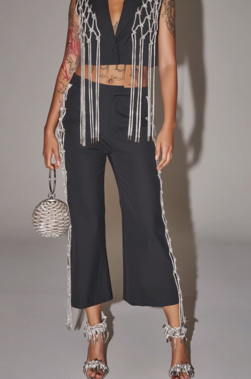 Video of woman modeling the NINA RHINESTONE CULOTTES and metallic fringe high heels