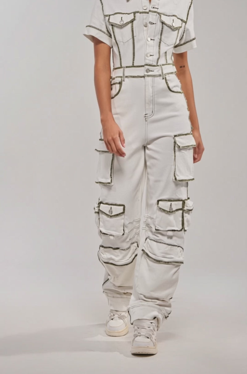 Video of woman modeling the BROOKLYN UTILITY DENIM JUMPSUIT with multiple cargo pockets 