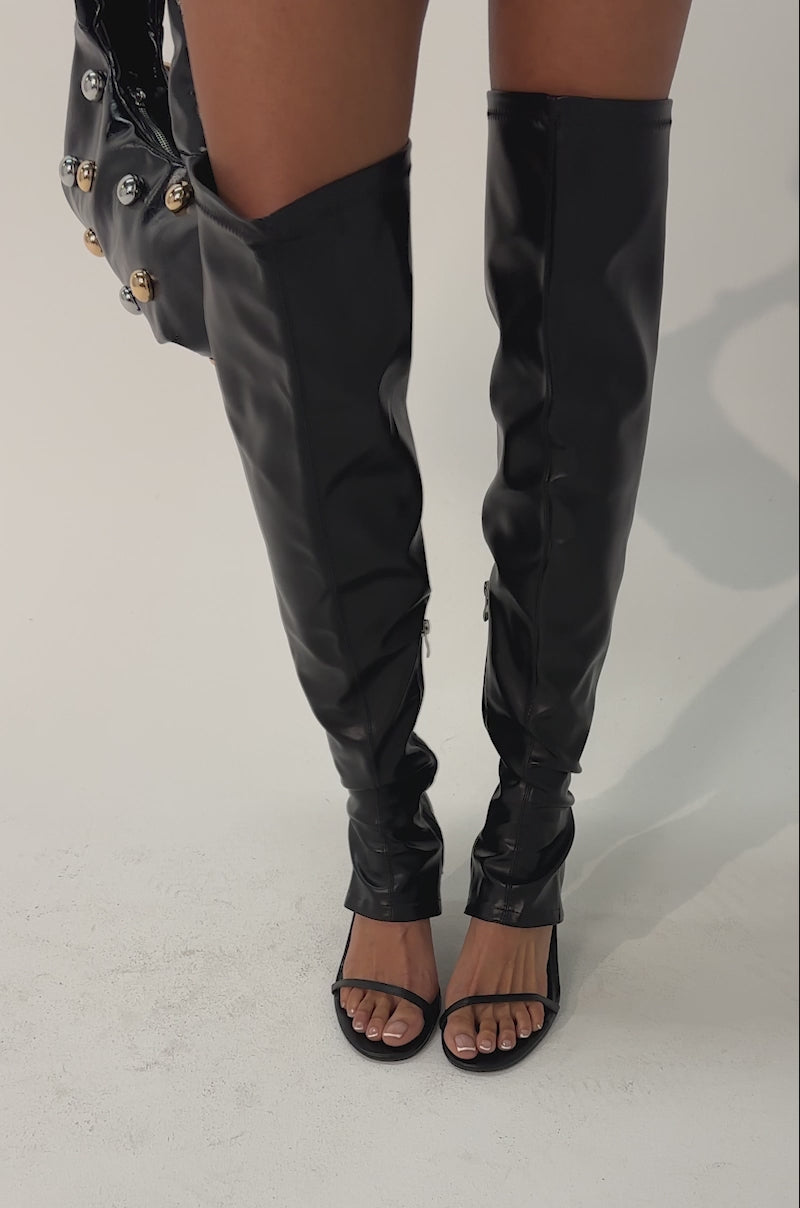 Video of woman modeling the AZALEA WANG RAGNAR BLACK CHUNKY STRETCH PU OVER THE KNEE BOOT.