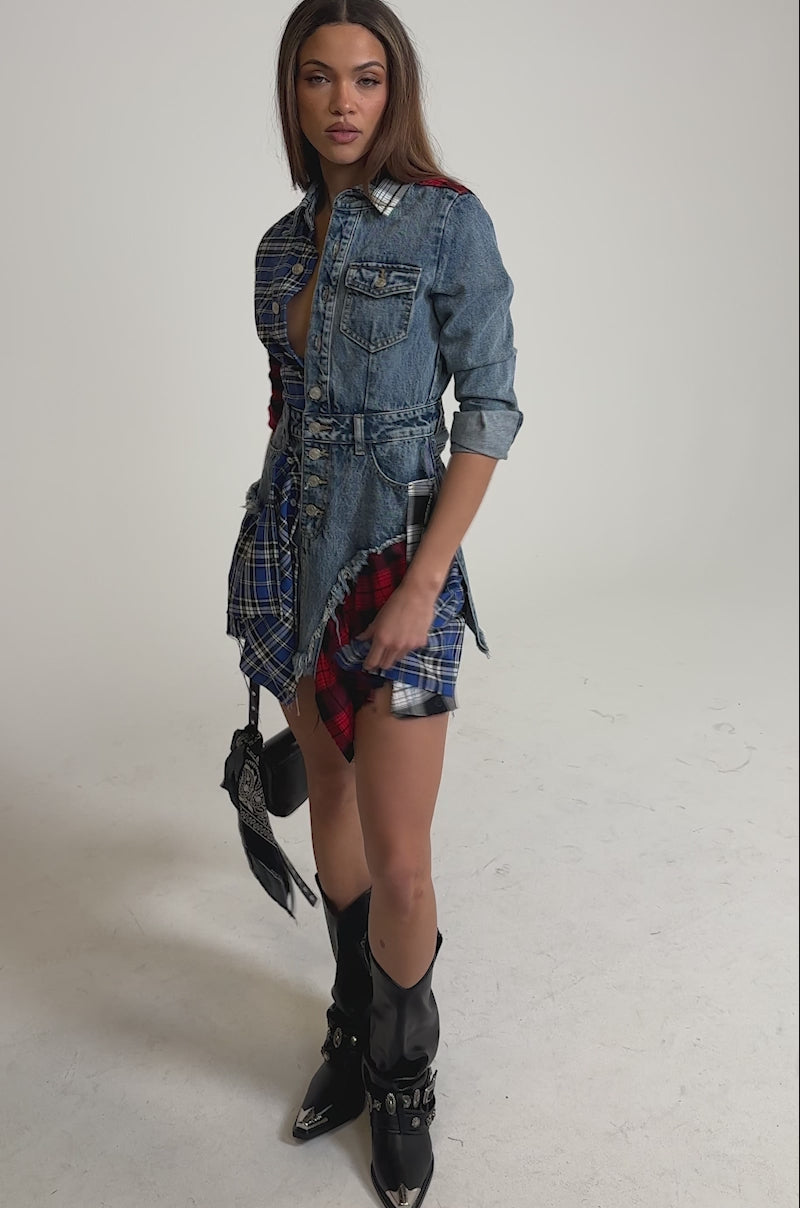 Video of woman modeling the PATCHWORK PLAID DENIM MINI DRESS with a button-down front, frayed edges, and asymmetrical hem