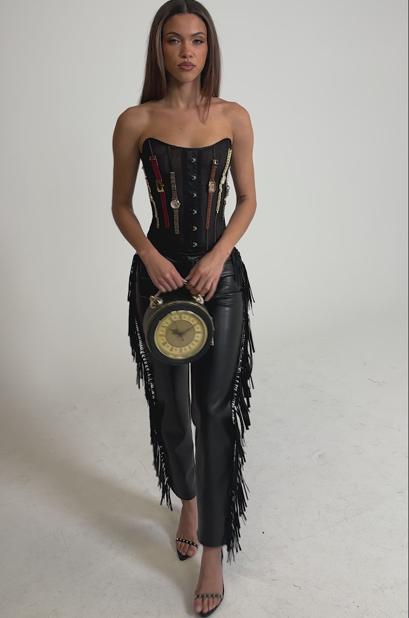 Video of woman modeling the LETS GO TO THE RODEO FRINGE FAUX LEATHER PANT 