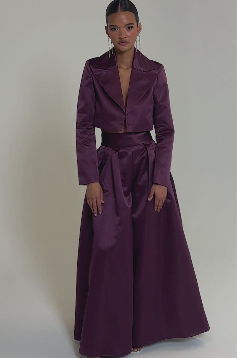 Video of woman modeling the ON AND ON CROPPED SATIN BLAZER styled with wide-legged satin pants.