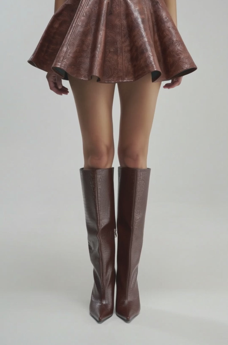 Video of a woman modeling the TOO GOOD FOR YOU MINI SKIRT in shiny brown embossed faux leather.