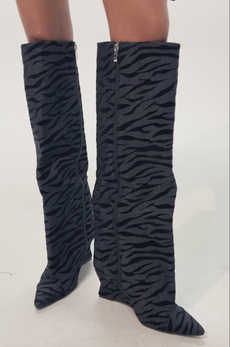 Video of woman modeling the AZALEA WANG KENYA DENIM TIGER WEDGE BOOT 