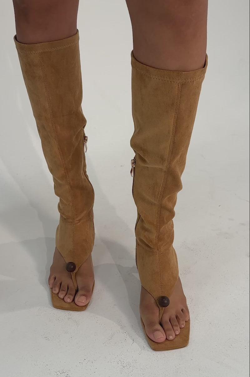 A video of a person wearing the AZALEA WANG DOTTIE Tan Stretch Faux Suede Boots with embellished heel and toe hardware.