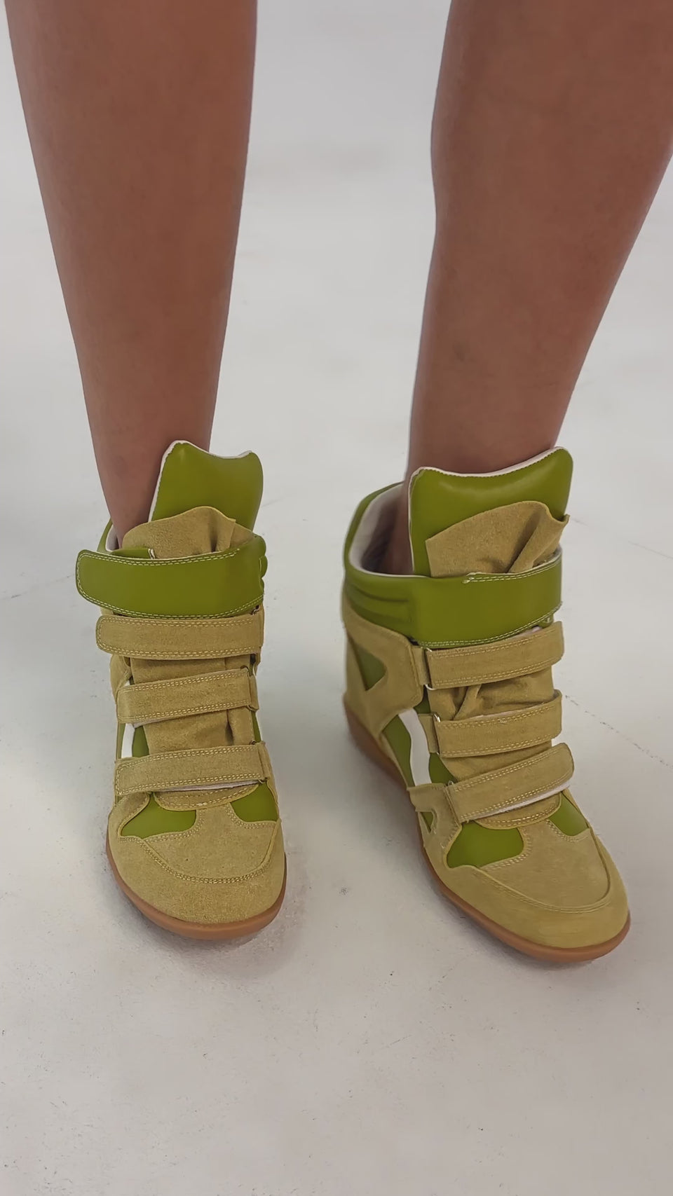 Video of woman modeling the AZALEA WANG BRYANT OLIVE WEDGE SNEAKER standing against a plain background.