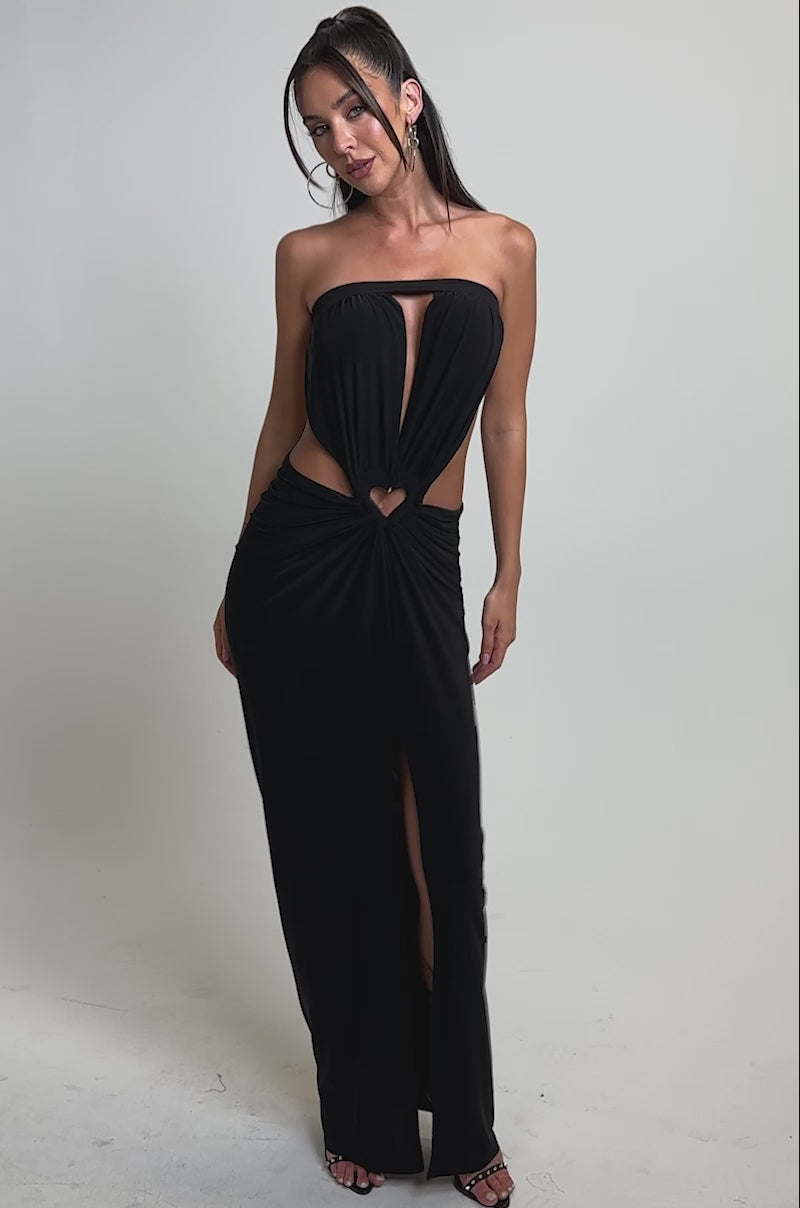A video of a woman wearing the DONT BREAK MY HEART STRAPLESS MAXI DRESS.