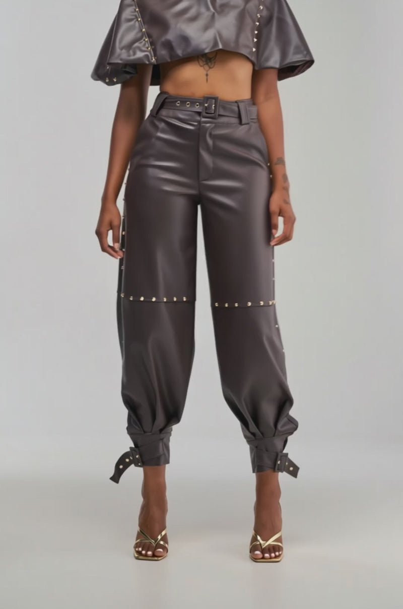 Video of a woman modeling the Studded Faux Leather Cape in Dark Chocolate.