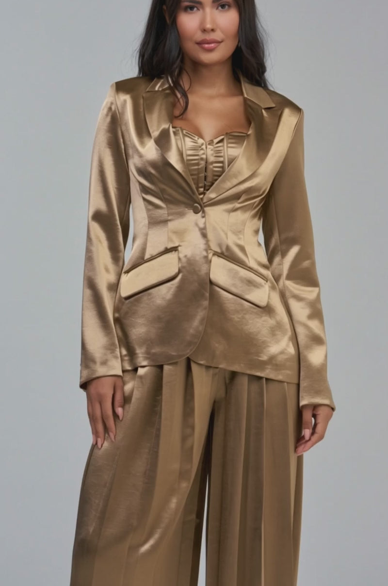 Video of a woman modeling the IRIS SATIN BLAZER IN LIGHT BROWN—a chic satin suit jacket.