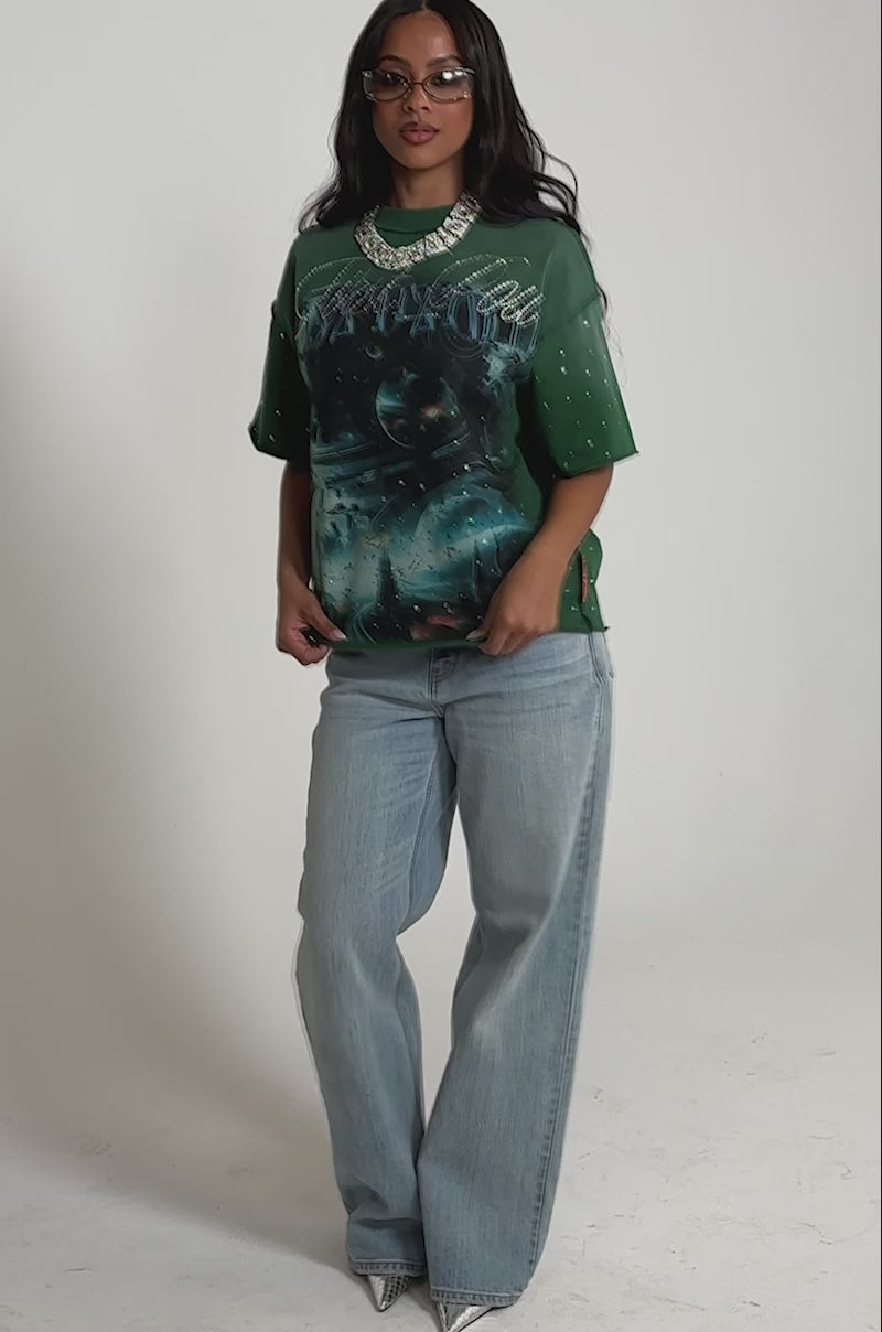 Video of woman modeling the FIRST ROW INTERSTELLAR RHINESTONE FRENCH TERRY TEE with a cosmic print and rhinestone accents.