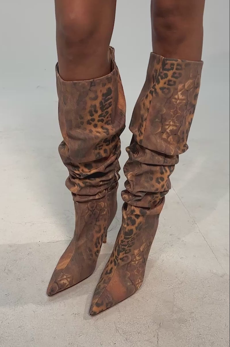 Video of woman modeling the AZALEA WANG STERRE ANIMAL PRINT STILETTO BOOTS with a brown and black leopard design