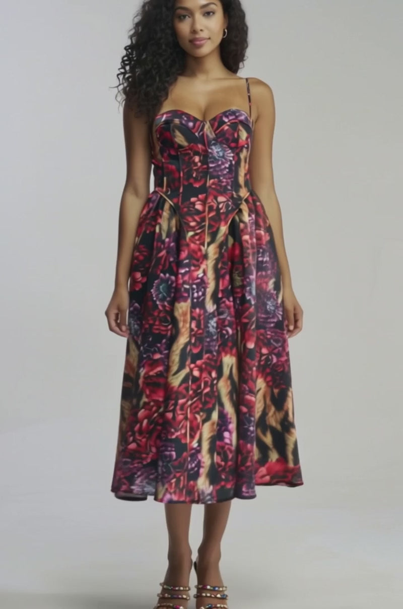 Video of woman modeling the FEELING FLORAL MAXI DRESS IN TIGER MULTI, a colorful, patterned sleeveless evening dress featuring a fitted bodice and flared skirt