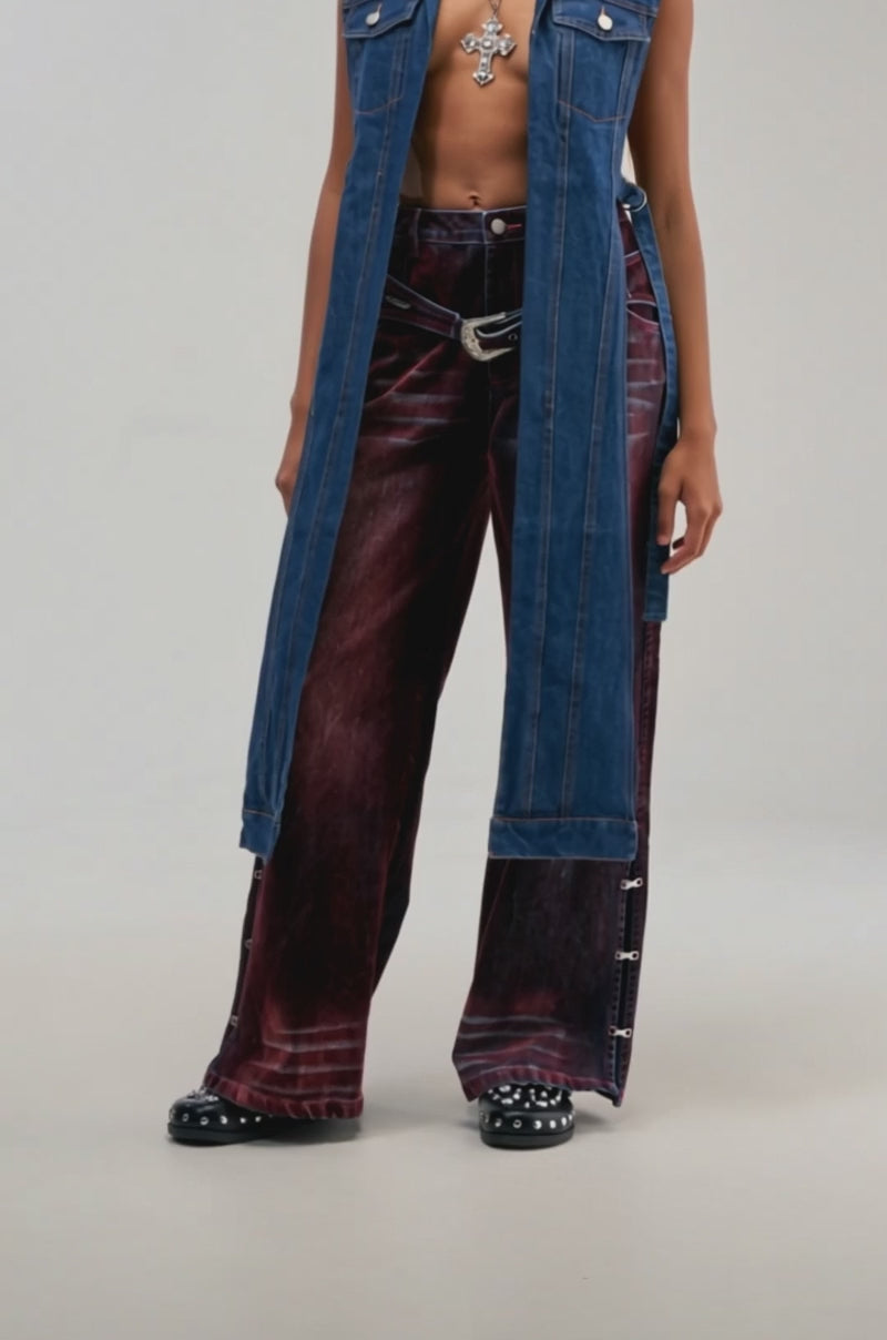 Video of a woman modeling the DOWN TO IT SPLIT VEST IN DARK DENIM—a tailored sleeveless denim vest.
