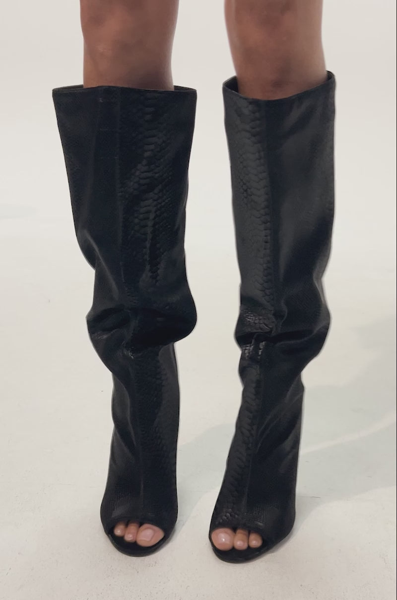 Video of woman modeling the AZALEA WANG VINCENT BLACK SNAKE OPEN TOE WEDGE BOOT