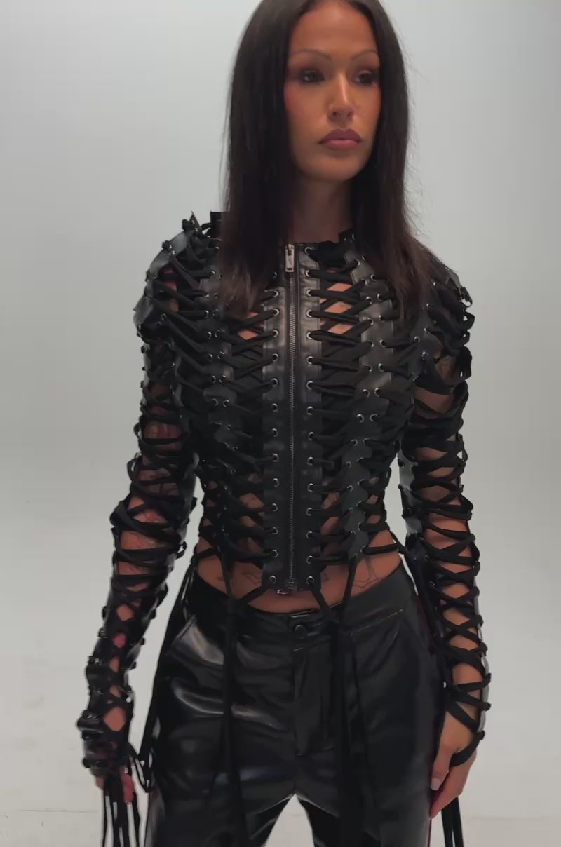 Video of a woman modeling the BARELY THERE LACE UP JACKET.