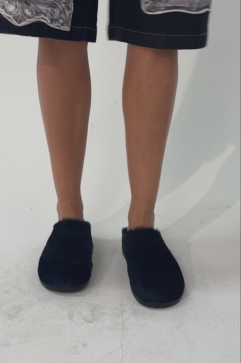 A video of a model wearing the AZALEA WANG RAMSES NAVY SLIP ON FLAT.