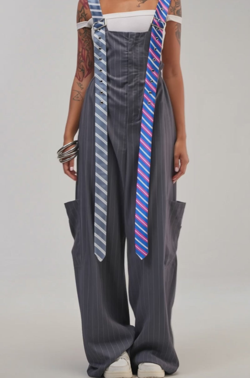 Video of a woman modeling the CLASS ACT PINSTRIPE OVERALLS in grey.