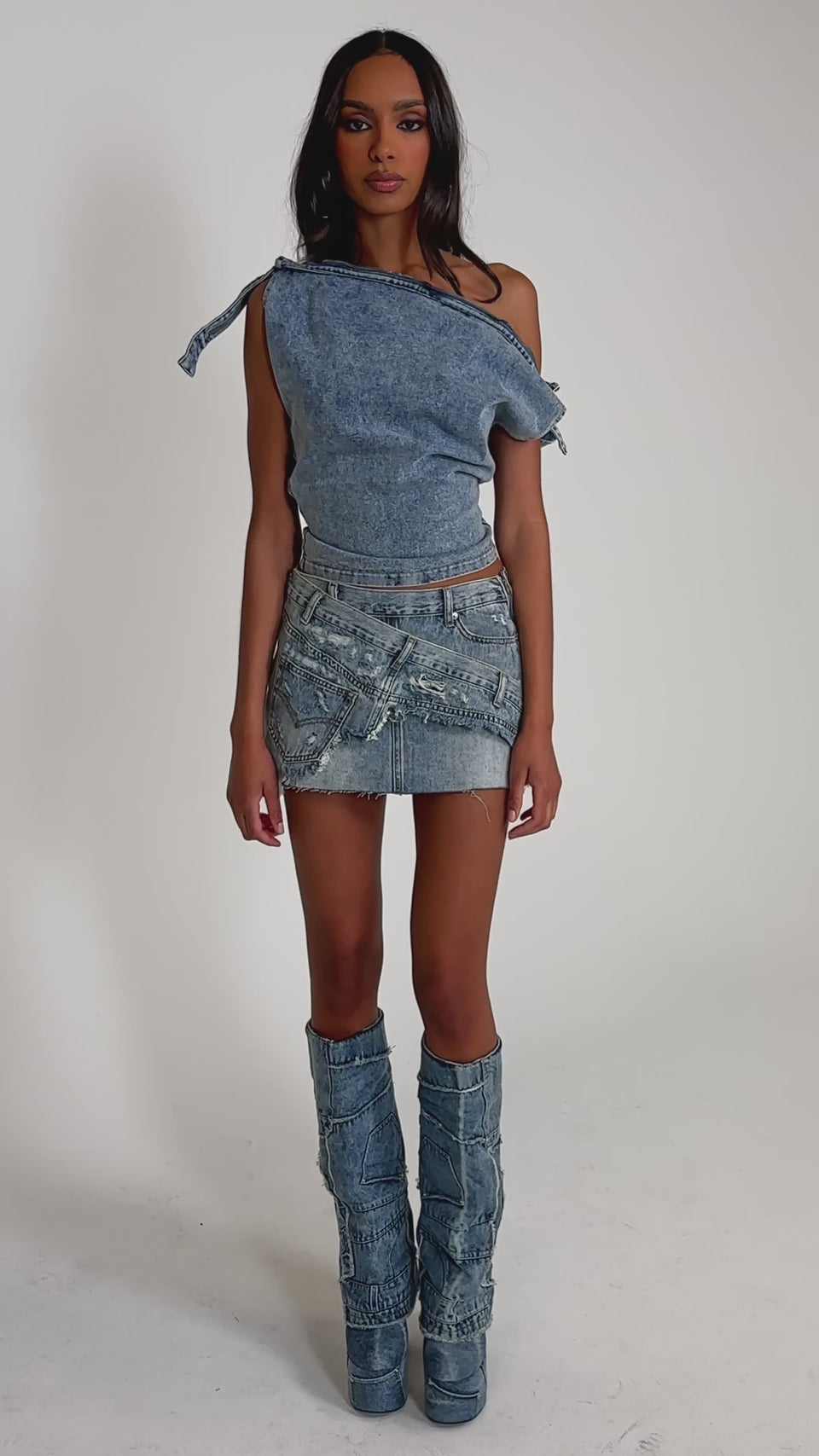 Video of woman modeling the WEEKEND VIBES DENIM BLOUSE and a frayed denim skirt 