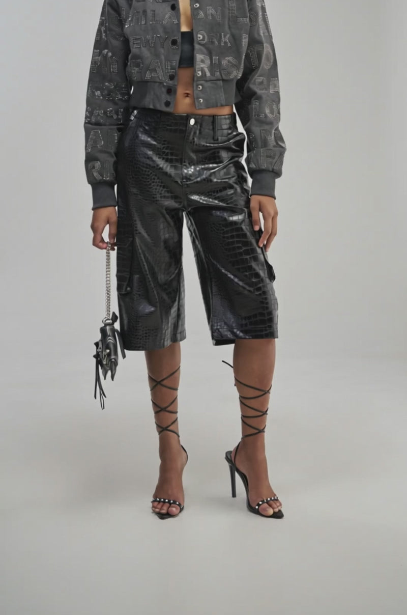 Video of a woman modeling the THE BEST CROC BERMUDA SHORT—black, shiny, croc-embossed bermuda shorts.