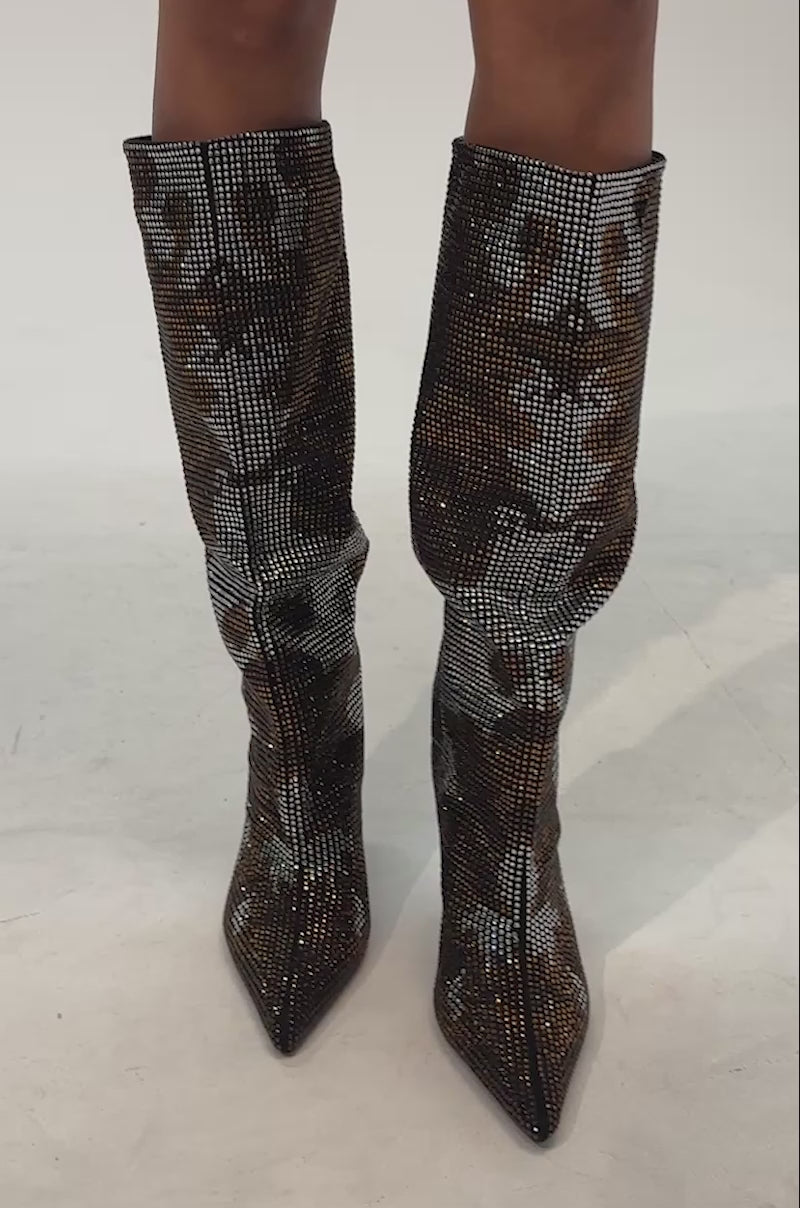 Video of woman modeling the AZALEA WANG ORIEL BRONZE MULTI PRINT RHINESTONE STILETTO BOOT—knee-high, pointed toe boots embellished with brown and silver rhinestones, and featuring a sleek stiletto heel