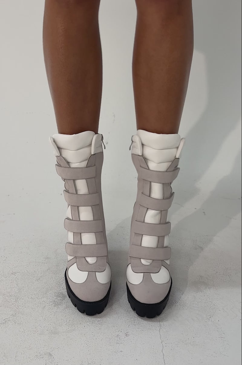A video of a person in the AZALEA WANG SAVI GREY SPORTY VELCRO BLOCK BOOTIE.