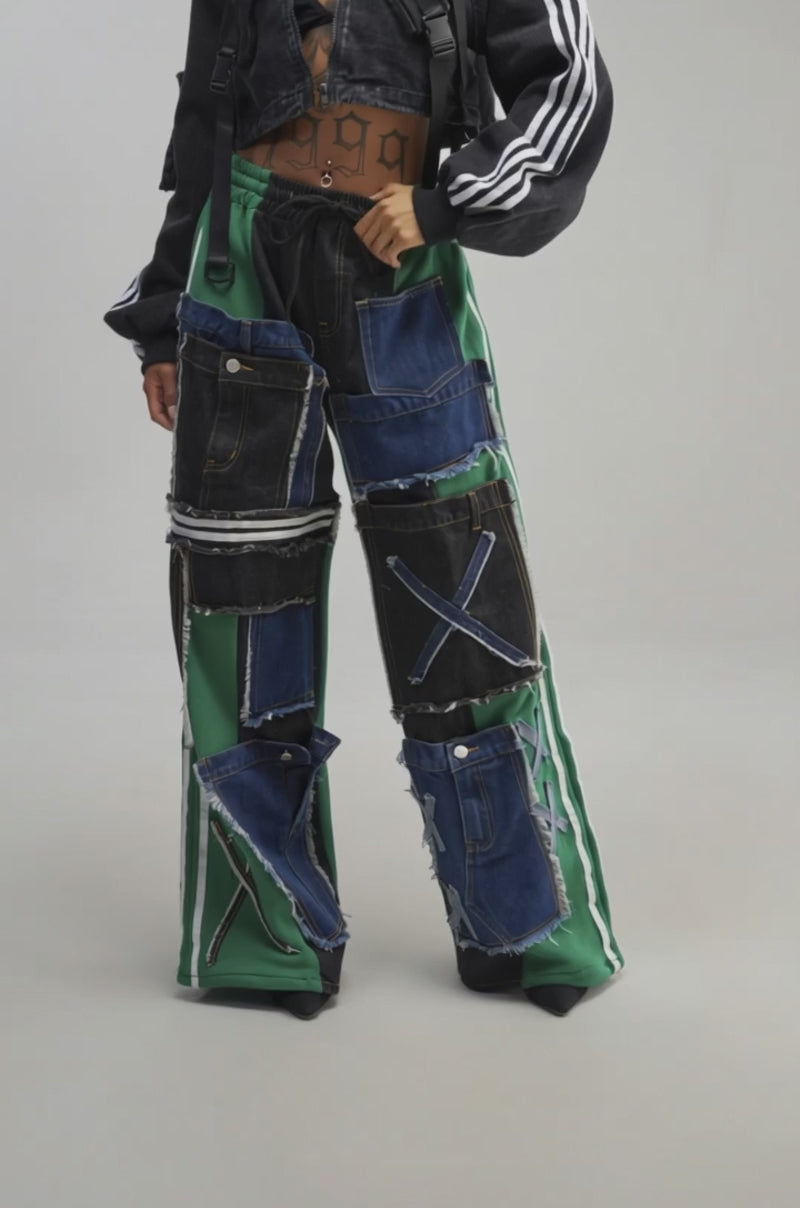 Video of a woman modeling the GAME DAY VIBES JOGGER—green wide-leg joggers featuring denim patchwork.