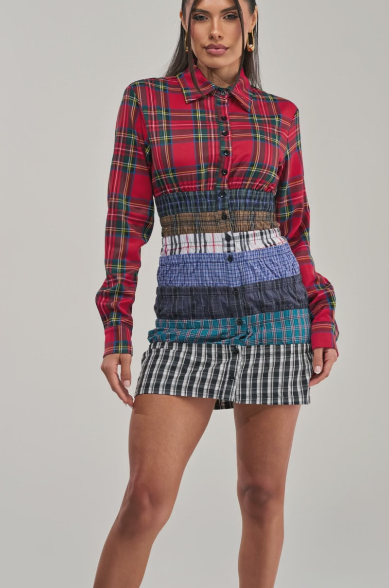 Video of a woman modeling the LAYERS TO MY LOVE FLANNEL MINI DRESS, featuring patchwork plaid and stripes.