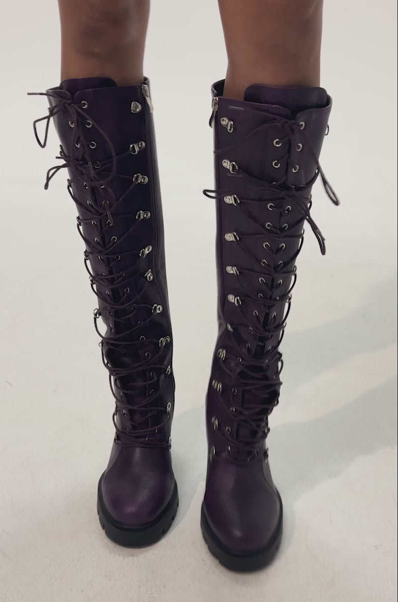 Video of woman modeling the AZALEA WANG AURIGA PLUM LACE UP BLOCK BOOT—eye-catching, knee-high purple leather boots with bold block heels.