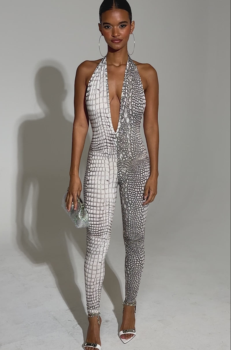 ON THE MOVE CROC PRINT JUMPSUIT – AKIRA